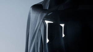 Teaserbild der Front und Lichtsignatur vom verhüllten Kia EV2
